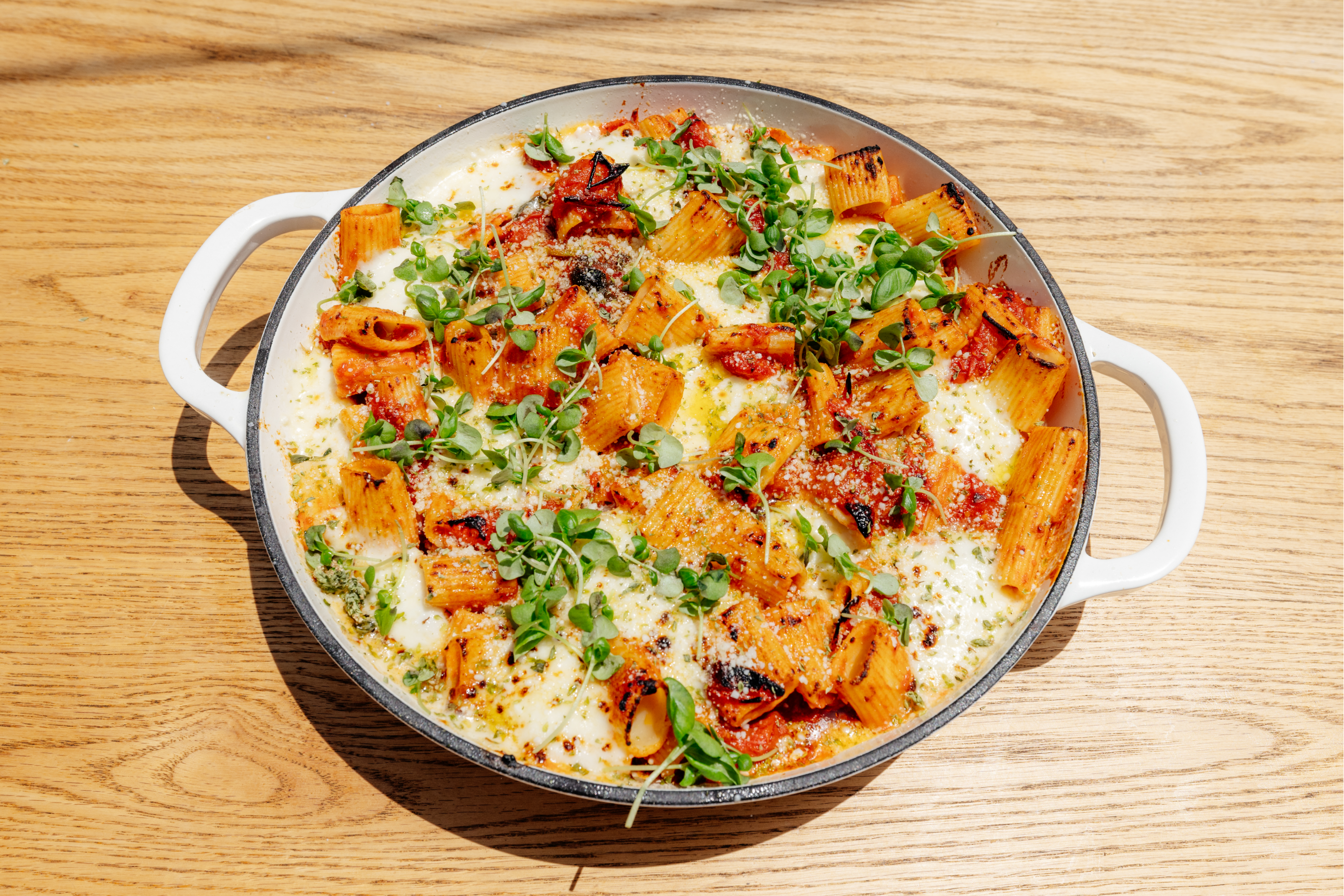 Baked Rigatoni with blistered cherry tomatoes, fresh mozzarella and fe ...